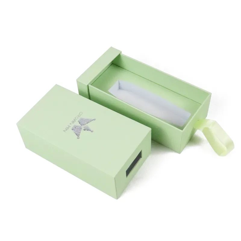 Side angle shot slide out cosmetic boxes showing soft satin ribbon pull tab detail for easy drawer access
