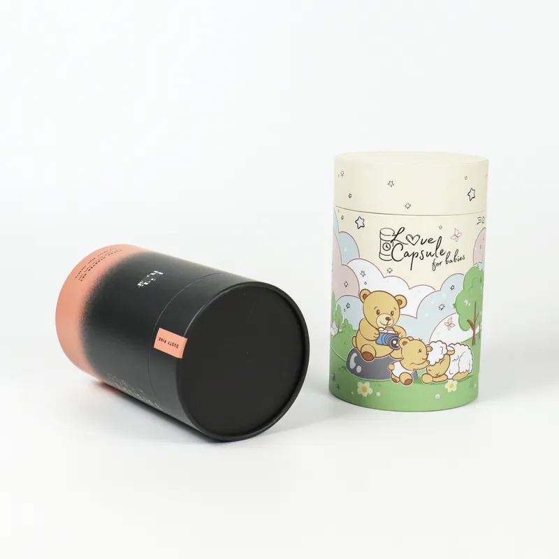 Slide-off round lid detached from gradient matte cylinder boxes, showing empty black hollow interior cylindrical tube packaging