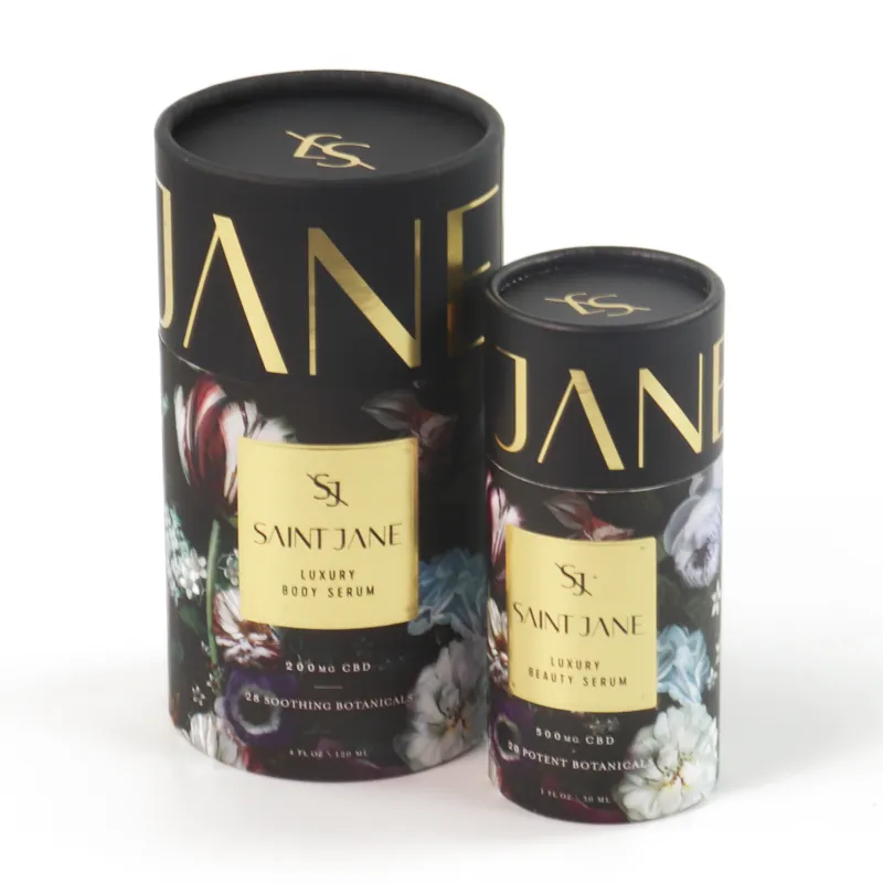 Slide-off lid removed open cylinder boxes showing empty black interior, vintage floral printed cosmetic tube packaging for beauty serums