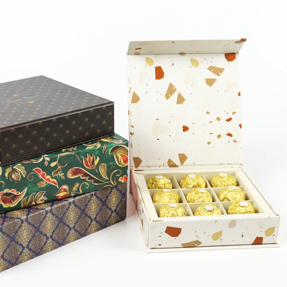 Stack of 3 custom printed rigid magnetic box designs, open terrazzo interior square magnetic box with 9-grid divider holding gold foil chocolate truffles