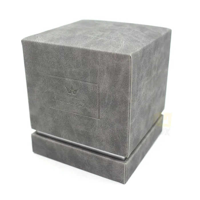 Full standing display of square two-piece lid-base candle boxes wrapped in muted grey soft suede texture paper