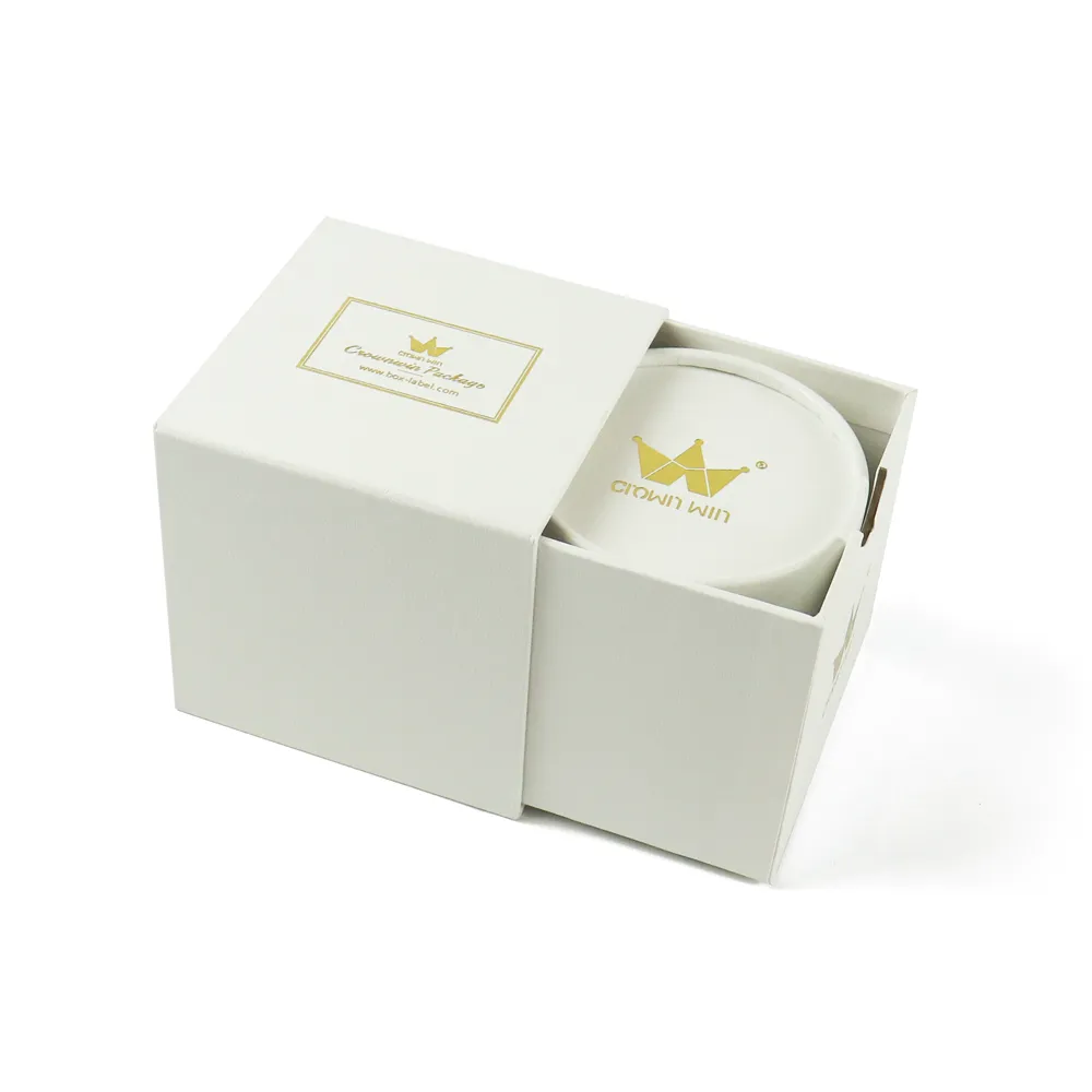Three-quarter angled display of complete set slide drawer candle boxes with gold foil border label and branded round candle canister