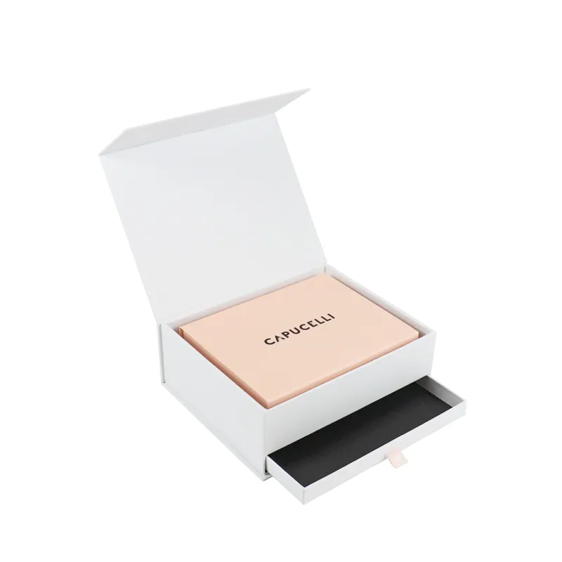 Three-quarter open view of two-tier matte white flip drawer cosmetic boxes with blush pink inner jewelry box placed inside main compartment