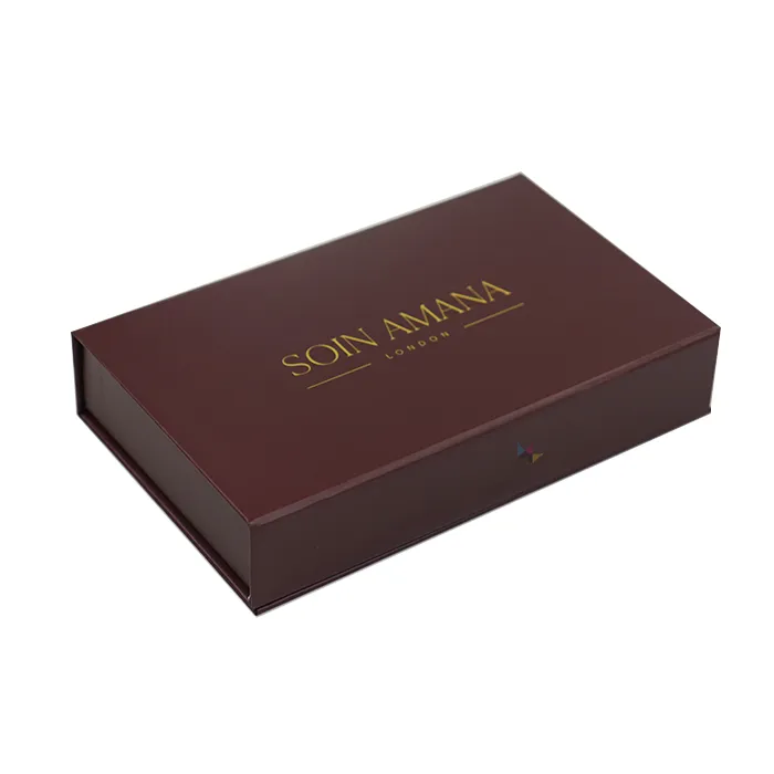 Three-quarter side profile shot of fully closed matte wine red rigid magnetic skincare packaging gift box