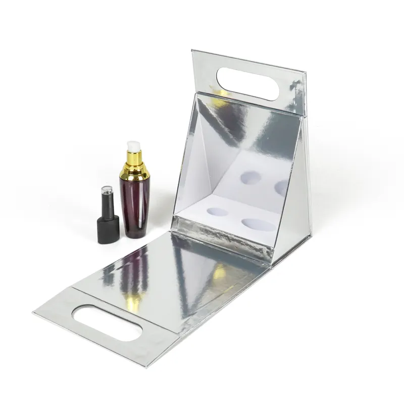 Tilted open triangle folding box close-up highlighting dual oval cutout carry handles and reflective mirror silver metallic surface finish