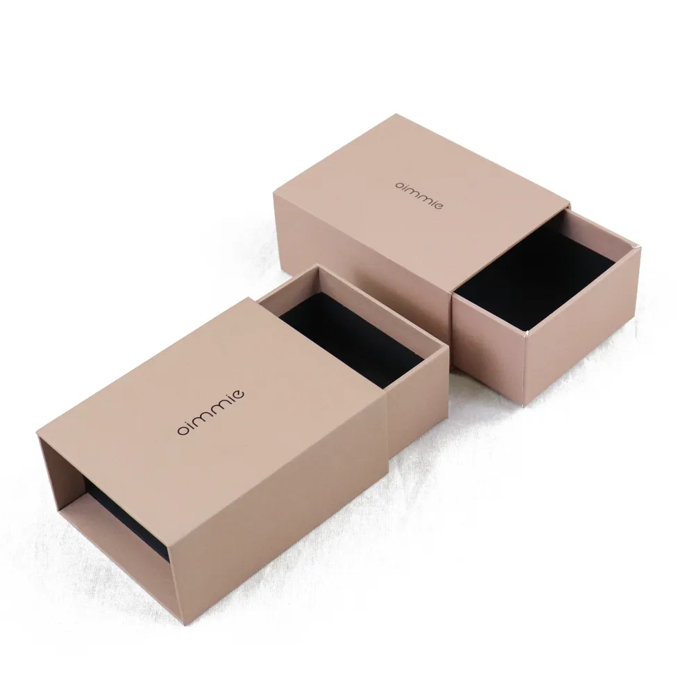 Top down flat lay open slide drawer perfume boxes, blank empty black lined cavity without perfume bottles