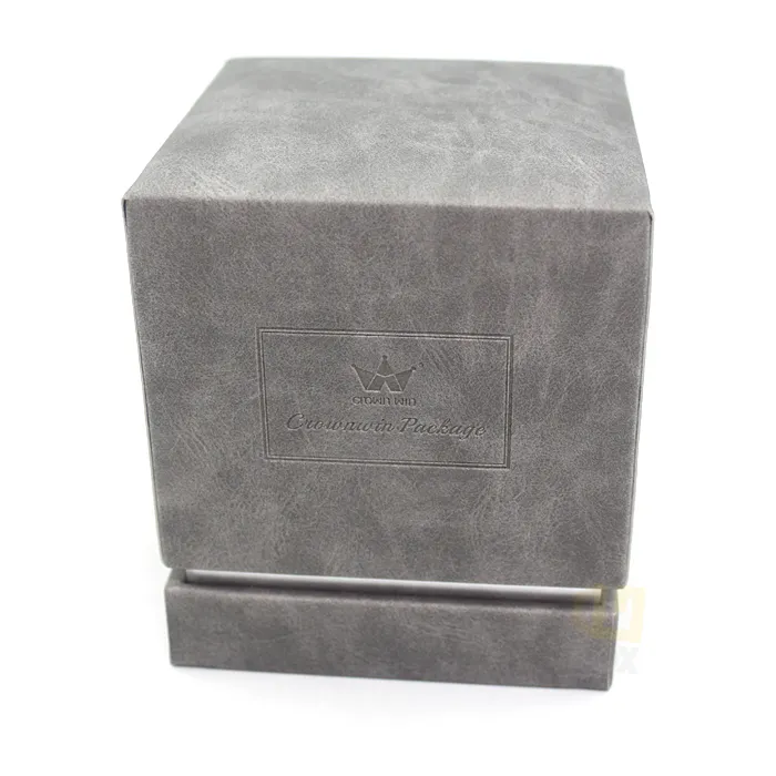 Top down interior shot of silver metallic inner tray with pre-cut circular corrugated ring liner for glass scented candle jars inside grey candle boxes