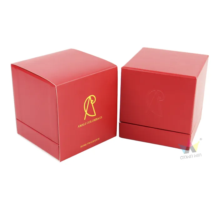 Two square red leather texture candle boxes side by side, front box with gold foil logo, lid box with blind embossed brand emblem