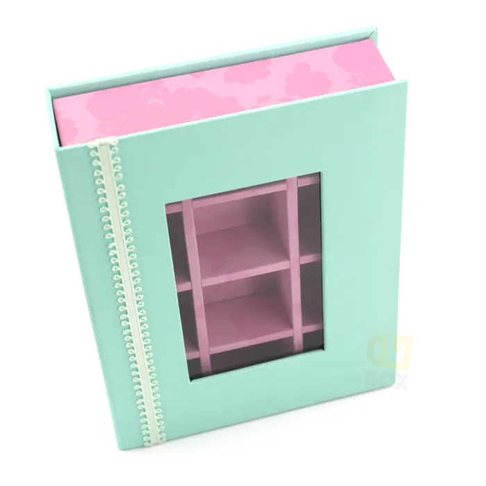 Vertical standing book shaped window box packaging close-up highlighting delicate lace spine and front display window detail