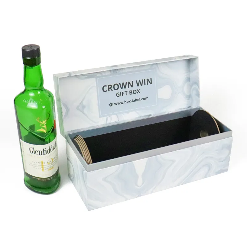 Single Glenfiddich whiskey bottle placed beside unfilled marble magnetic closure boxes, premium spirit gift packaging display