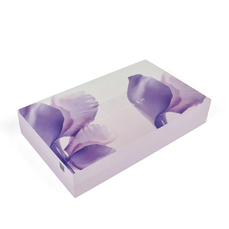 Closed custom rigid skincare packaging gift box, outer surface with elegant purple floral full‑color printing
