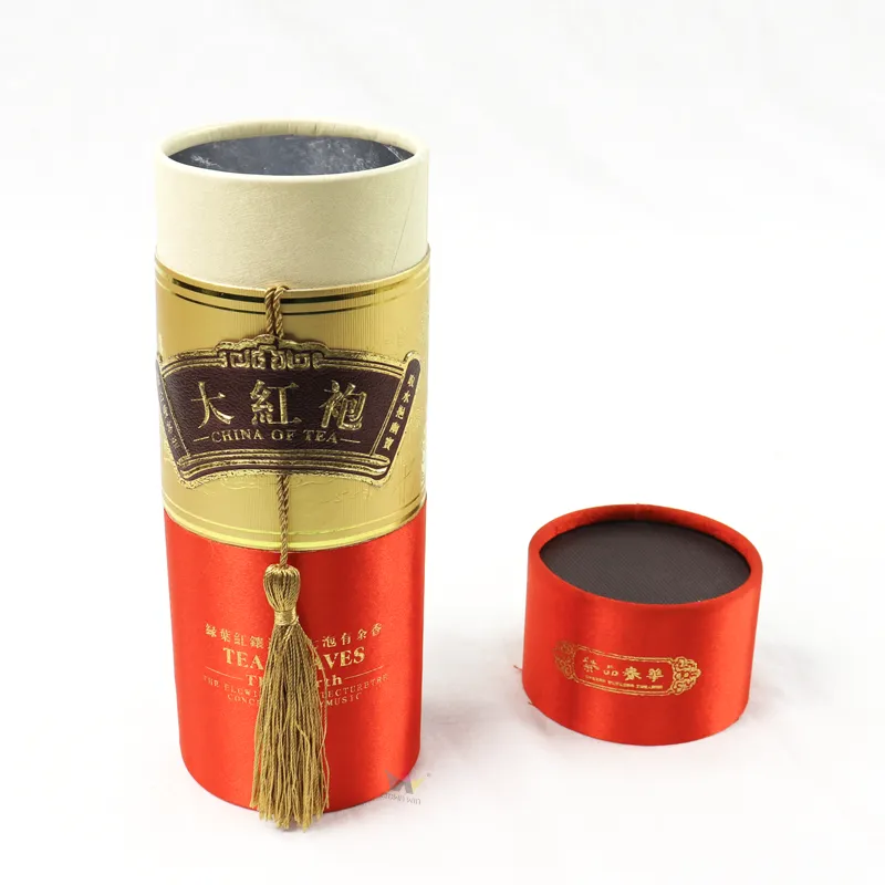 Custom tea packaging cylinder tube box, satin fabric lid and golden tassel decoration detail