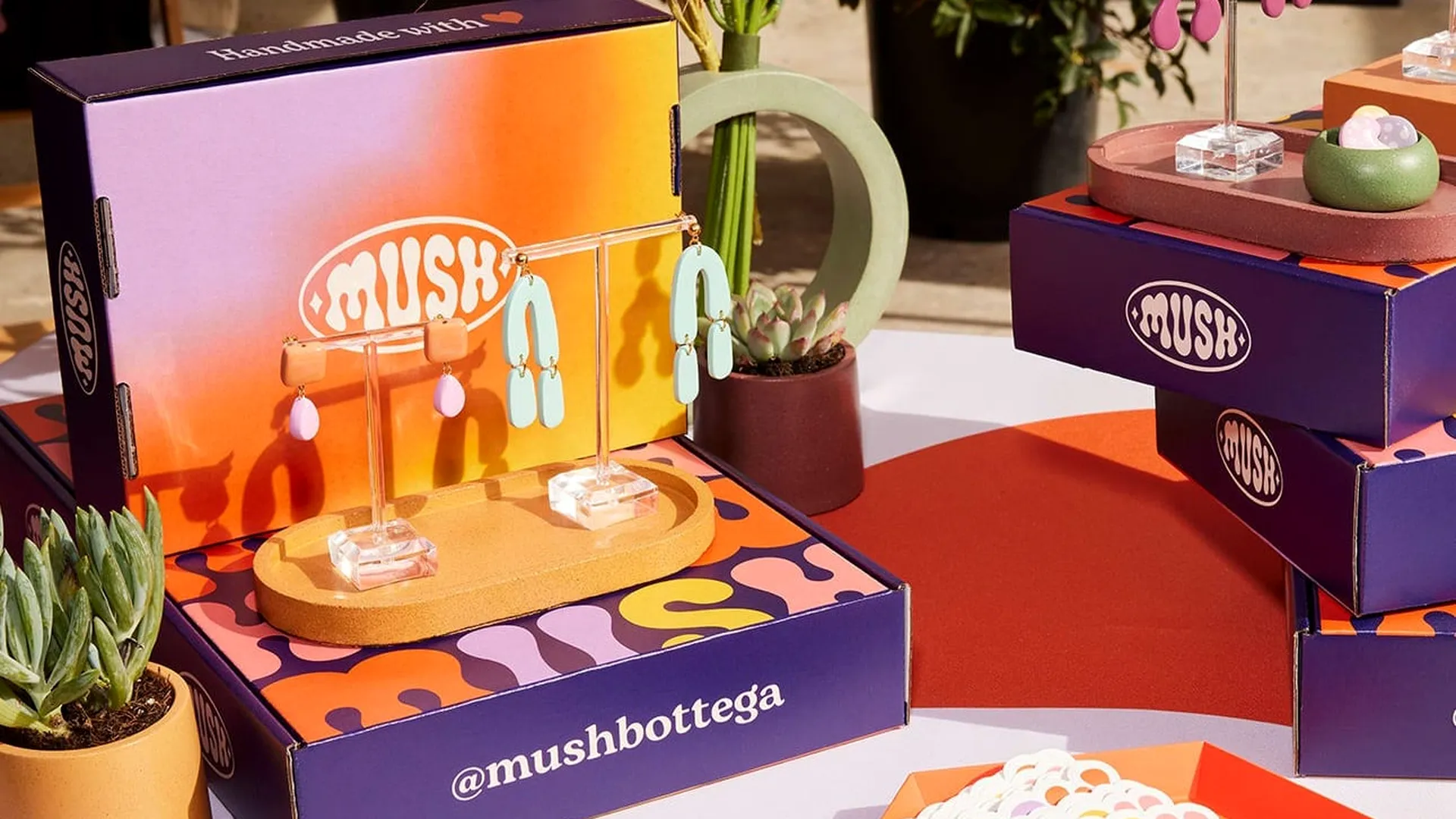 Colorful custom gift boxes illustrating premium packaging on a budget
