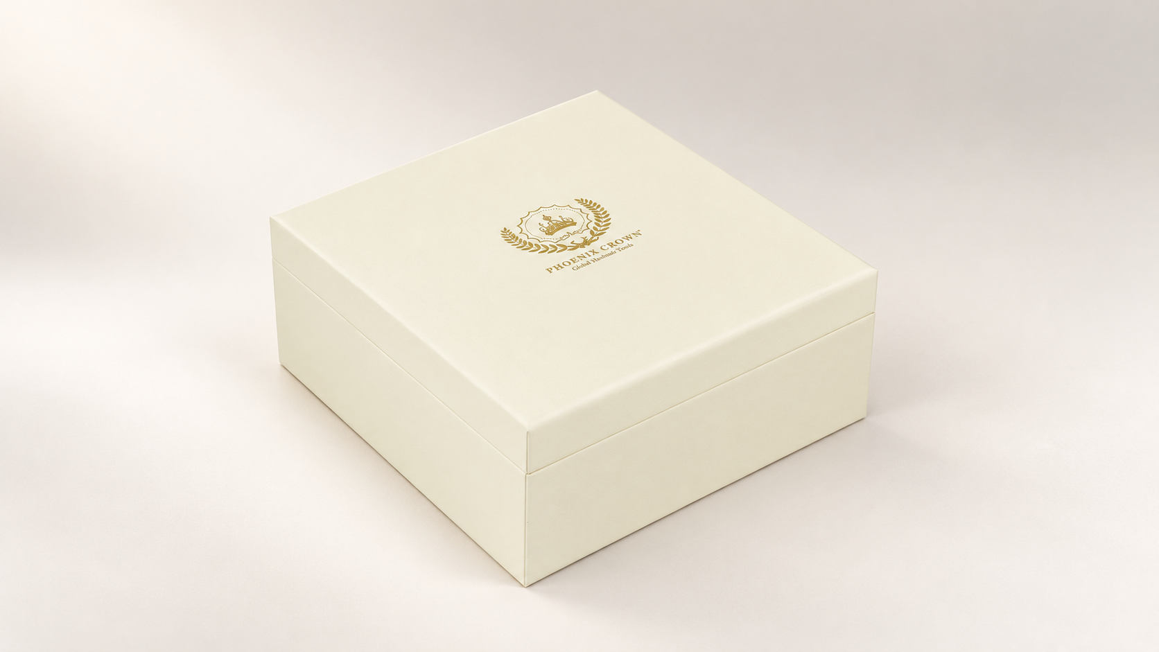 Closed cream cosmetic box with gold crest, centered on a soft ivory studio background