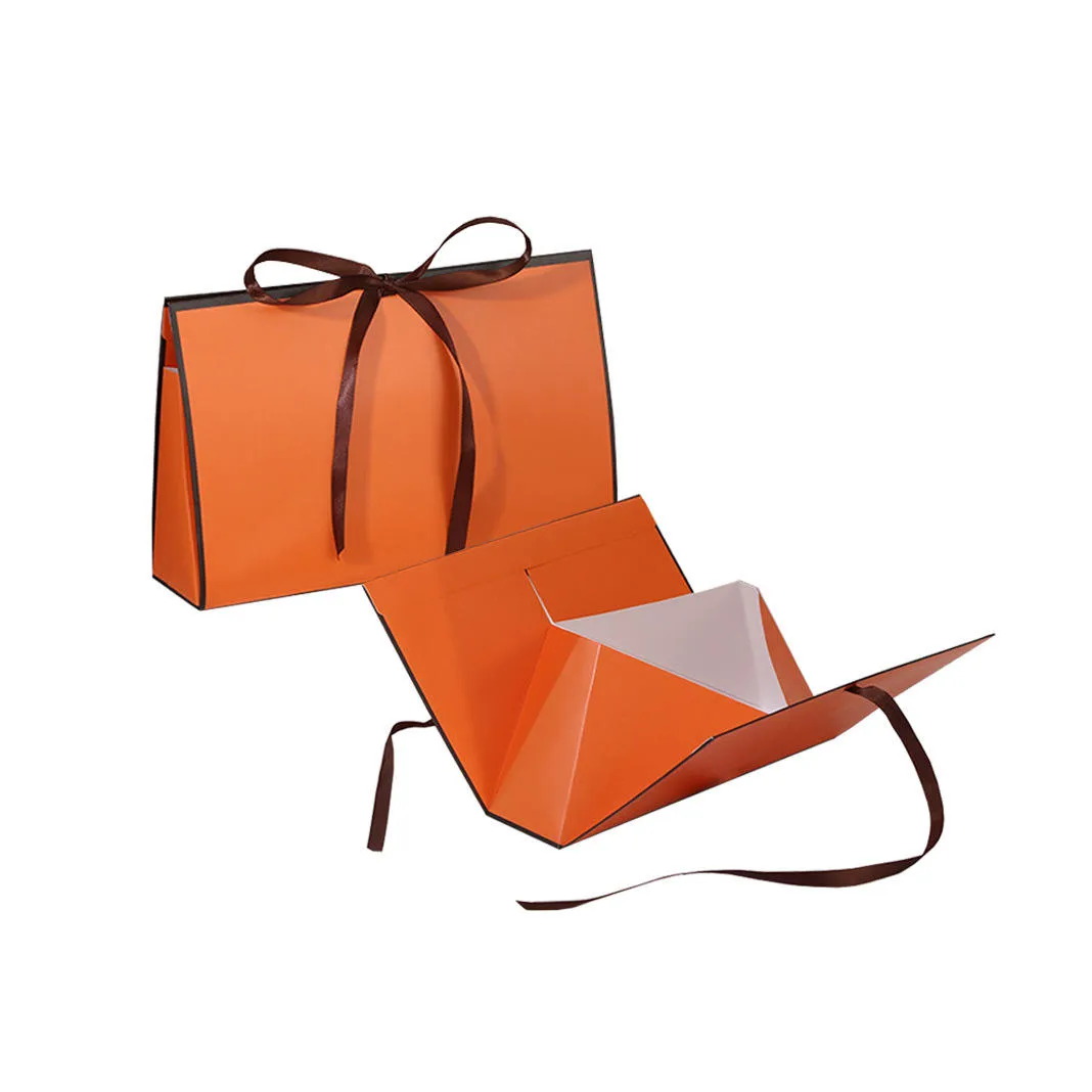 Orange paper shopping bag with matching ribbon handles