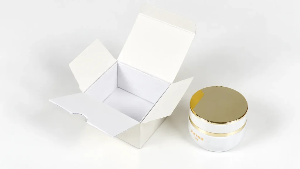 Custom cosmetic packaging MOQ sample with a cream jar and matching carton.